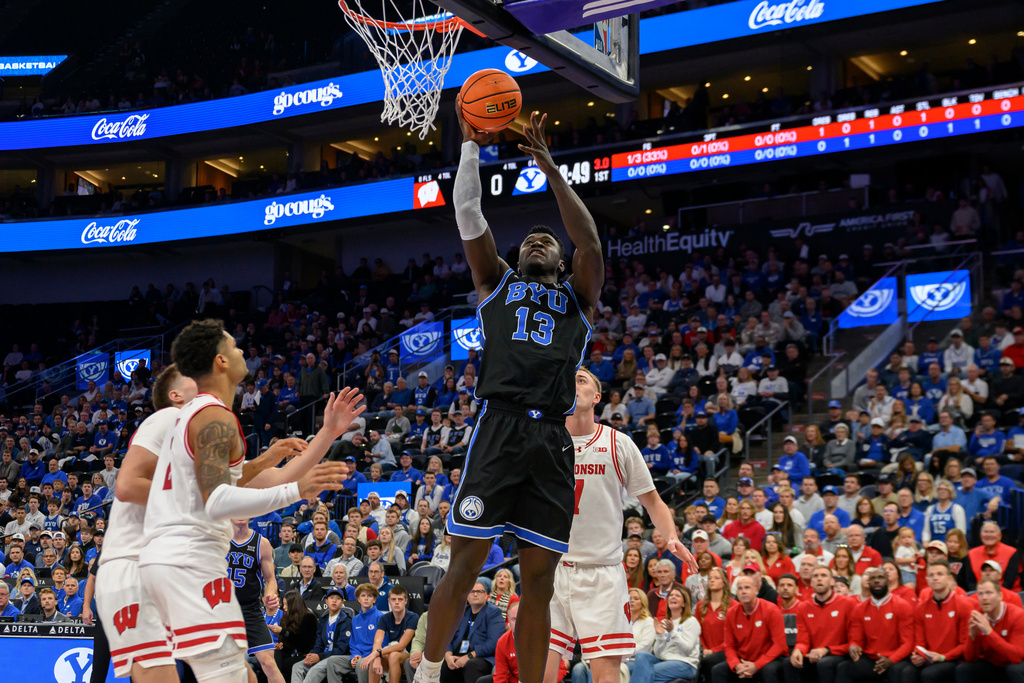BYU center Keba Keita (13) goes to the basket during the first half of an NCAA college basketball game against Wisconsin, Friday, Nov. 21, 2025, in Salt Lake City. (AP Photo/Tyler Tate)