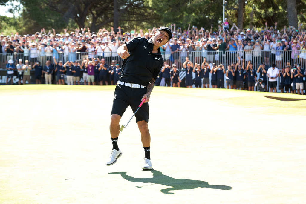 Anthony Kim of 4Aces GC reacts to his putt on the 18th green during the final round of the LIV Golf Adelaide at Grange Golf Club in Adelaide, Australia Sunday, Feb. 15, 2026. (Charles Laberge/LIV Golf via AP)