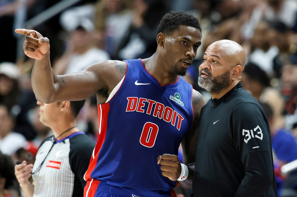 Detroit Pistons center Jalen Duren (0) talks with head coach J.B. Bickerstaff during the first half in Game 7 of a second-round NBA playoffs basketball series Sunday, May 17, 2026, in Detroit. (AP Photo/Duane Burleson)