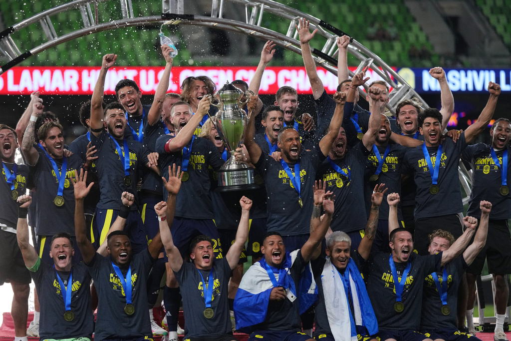 Nashville SC players celebrate their win over Austin FC in an U.S. Open Cup final soccer match in Austin, Texas, Wednesday, Oct. 1, 2025. (AP Photo/Eric Gay)