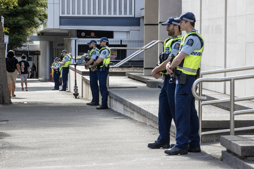Police stand in front of the Court of Appeal in Wellington, New Zealand, Monday, Feb. 9, 2026, where the court will hear an appeal from Brenton Tarrant. (Monique Ford/The Post/STUFF via AP)