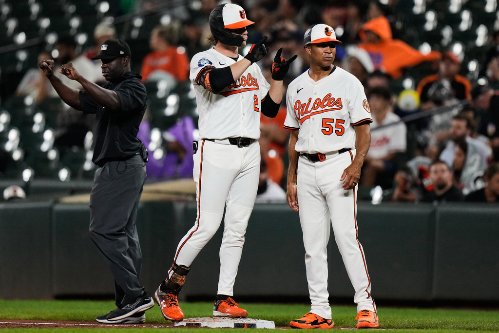 Baltimore Orioles' Gunnar Henderson (2) celebrates after hitting an RBI single during the third inning of a baseball game against the Tampa Bay Rays, Tuesday, Sept. 23, 2025, in Baltimore. (AP Photo/Stephanie Scarbrough)