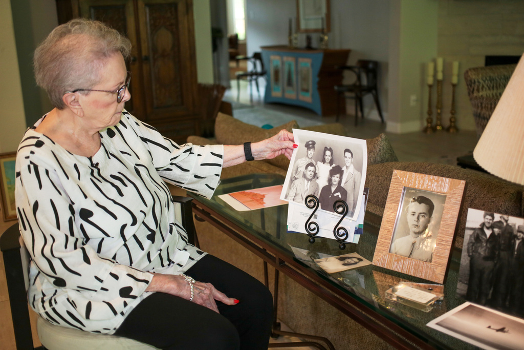 June West Brandt, 93, looks at a photo displaying her brother, William Durham West Jr., who was killed in World War II, Aug. 27, 2025, in Richmond, Texas. (AP Photo/Lekan Oyekanmi)