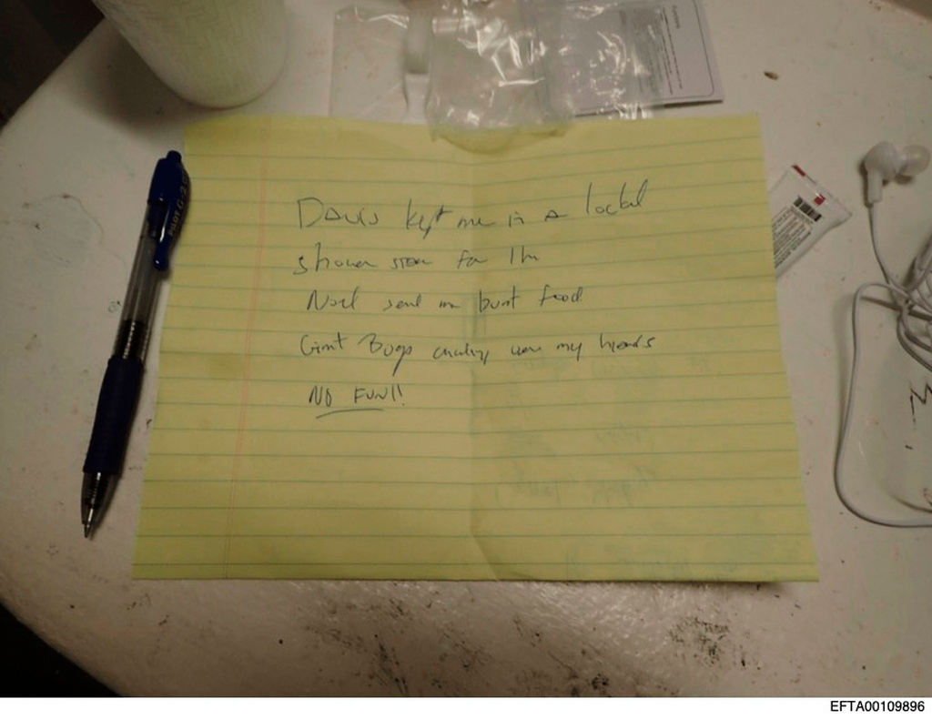 This undated photo released by the U.S. Department of Justice shows a photograph of a handwritten note complaining about jail conditions that was discovered in Jeffrey Epstein's cell at the Metropolitan Correctional Center in New York City after Epstein's suicide. (U.S. Department of Justice via AP)