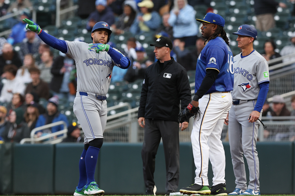Toronto Blue Jays George Springer reacts at first base after hitting a single to Minnesota Twins center fielder Byron Buxton (not pictured) during the first inning of a baseball game Friday, May 1, 2026, in Minneapolis. (AP Photo/Stacy Bengs)