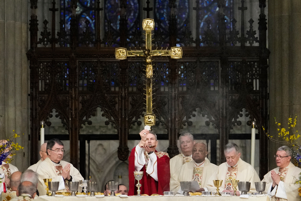 Archbishop Ronald Hicks says the Eucharistic prayer during his Mass of Installation at St. Patrick's Cathedral, Friday, Feb. 6, 2026, in New York. (AP Photo/Yuki Iwamura)