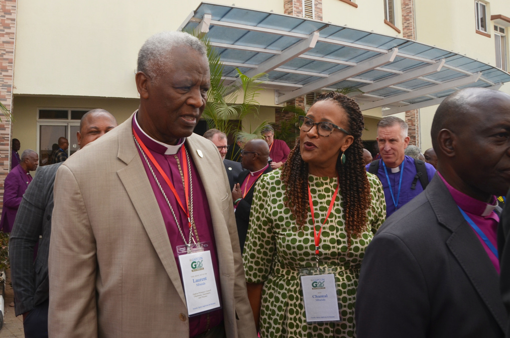 Rwanda Archbishop Revd Dr. Laurent Mbanda, chairman of the Global Fellowship of Confessing Anglicans, or Gafcon, left, and his wife Chantel Mbanda, leave after attending a religious service on the sidelines of a meeting by the Anglican Communion in Abuja, Nigeria, Wednesday, March 4, 2026. (AP Photo/Olamikan Gbemiga)
