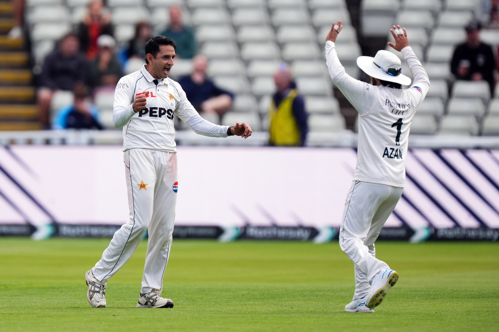 Pakistan's Muhammad Abbas, left, celebrates the wicket of England's Ben Duckett on day four of the third Test in Birmingham, England, Saturday Sept. 12, 2026. (Mike Egerton/PA via AP)