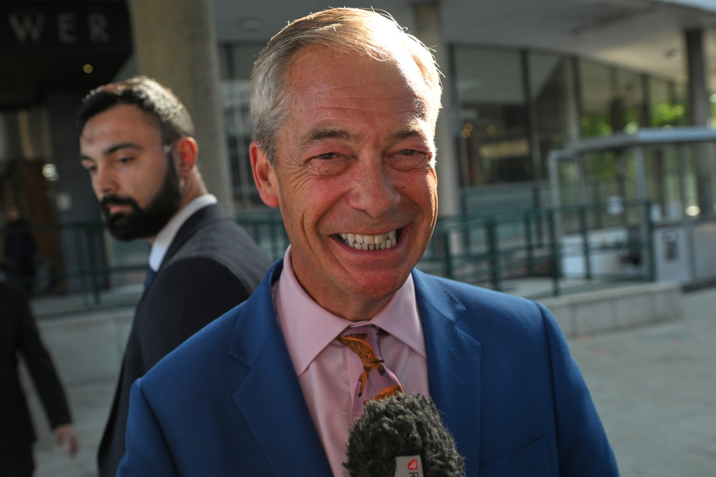 Britain's Reform UK leader Nigel Farage leaves Milbank Tower after he said he'll quit his Parliament seat and seek reelection in London, Tuesday, July 7, 2026.(AP Photo/Thomas Krych)