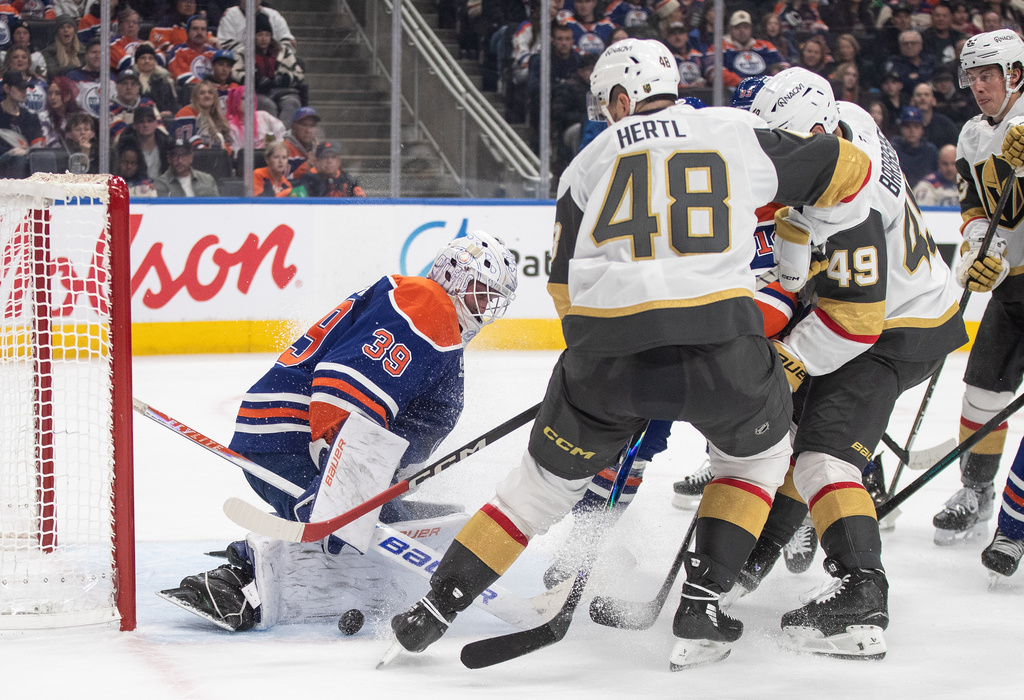 Vegas Golden Knights' Tomas Hertl (48) is stopped by Edmonton Oilers goalie Connor Ingram (39) during third-period NHL hockey game action in Edmonton, Alberta, Sunday, Dec. 21, 2025. (Jason Franson/The Canadian Press via AP)