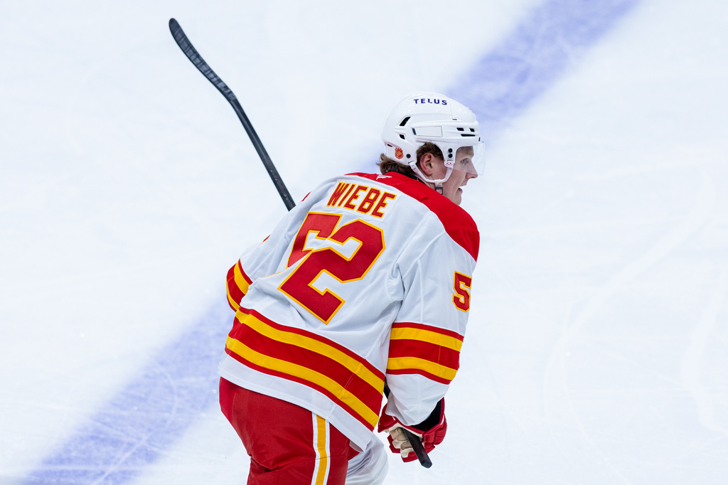 Calgary Flames defenseman Abram Wiebe skates during the first period of an NHL hockey game against the Seattle Kraken, Saturday, April 11, 2026, in Seattle. (AP Photo/Maddy Grassy)