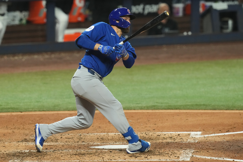 Chicago Cubs' Michael Busch hits a double during the fifth inning of a baseball game against the Miami Marlins Saturday, Sept. 5, 2026, in Miami. (AP Photo/Marta Lavandier)