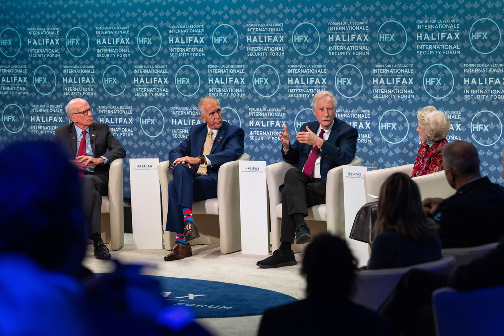 Senator Peter Welch, of Vermont, left to right, Senator Thom Tillis, of North Carolina, Senator Angus King, of Maine and moderator congresswoman Jane Harman, Commission on the National Defense Strategy, United States, take part in the Halifax International Security Forum, Saturday, Nov. 22, 2025. (Kelly Clark