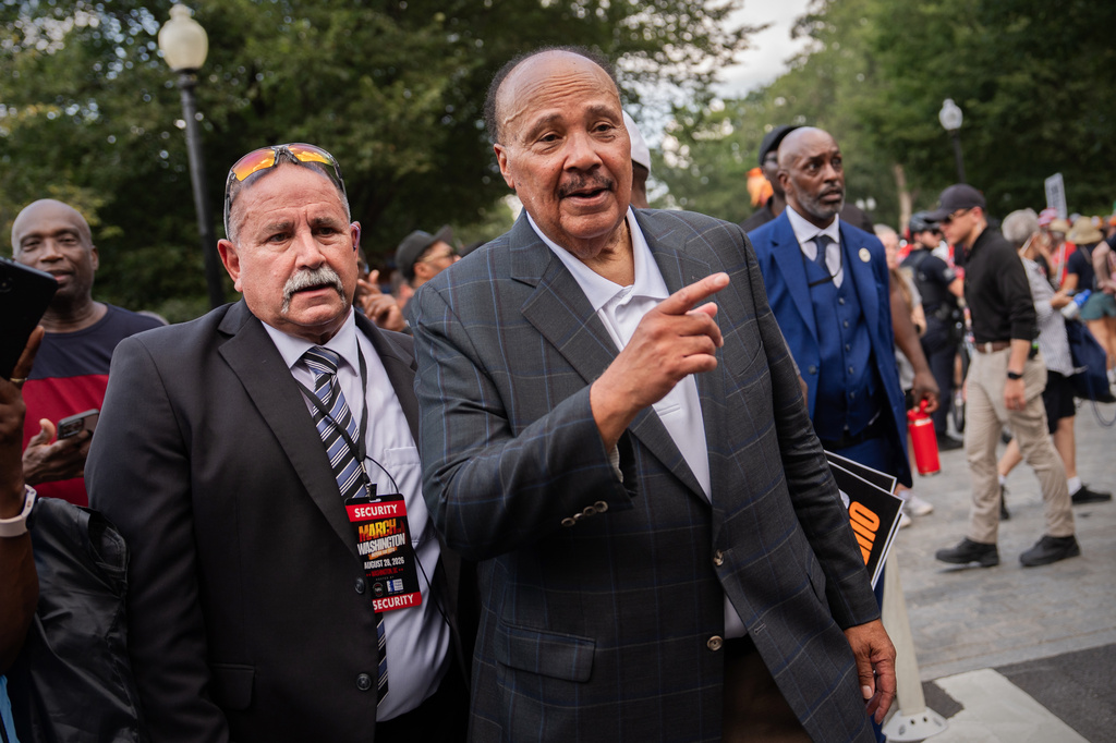 Martin Luther King III, right, departs from the Martin Luther King, Jr. Memorial following the March on Washington, Friday, Aug. 28, 2026, in Washington. (AP Photo/Julia Demaree Nikhinson)