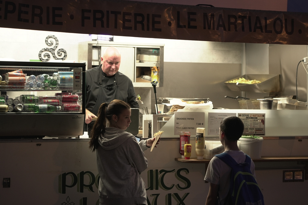 Martial Realland serves customers from his food truck in Saint-Just-en-Chaussee, France, Wednesday Sept. 23, 2026. (AP Photo/John Leicester)