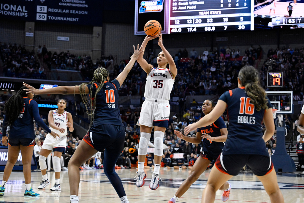 UConn guard Azzi Fudd (35) shoots over UTSA forward Sanaa Bean (10) during the second half in the first round of the NCAA college basketball tournament, Saturday, March 21, 2026, in Storrs, Conn. (AP Photo/Jessica Hill)