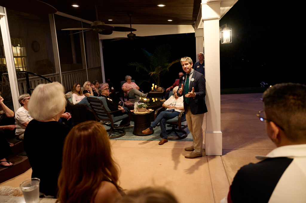 Paul Barringer, the Democratic nominee running for North Carolina's 13th Congressional District, speaks with voters at a campaign event, Oct. 8, 2026, in Garner, N.C. (AP Photo/Matt Ramey)