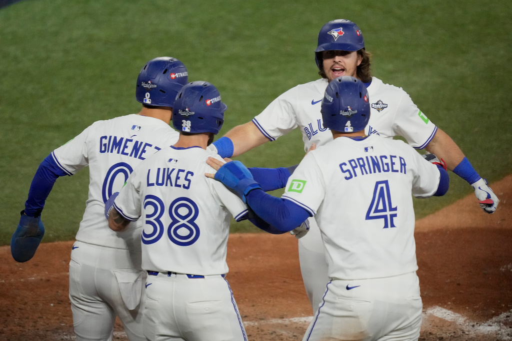 Toronto Blue Jays' Addison Barger celebrates his grand slam home run against the Los Angeles Dodgers during the sixth inning in Game 1 of baseball's World Series, Friday, Oct. 24, 2025, in Toronto. (AP Photo/Brynn Anderson)