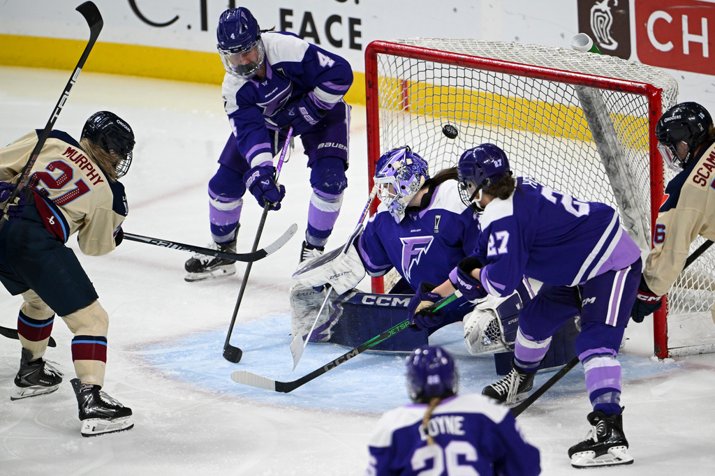 Montral Victoire forward Maureen Murphy (21) scores a goal against Minnesota Frost goaltender Maddie Rooney (35) in the third period of a Game 4 in a PWHL hockey playoff series game, Friday, May 8, 2026, in St. Paul, Minn. (Aaron Lavinsky/Minnesota Star Tribune via AP)