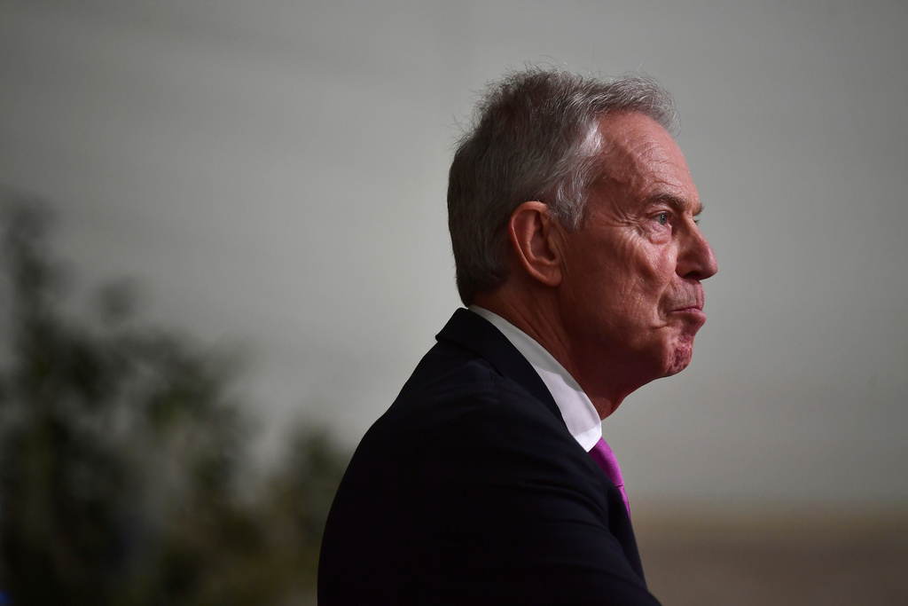 FILE - Former British Prime Minister Sir Tony Blair reacts as he gives a speech at Hillsborough Castle for the Gala dinner to mark the 25th anniversary of the Belfast/Good Friday Agreement, in Belfast, Northern Ireland, April 19, 2023. (Charles McQuillan/Pool Photo via AP, File)