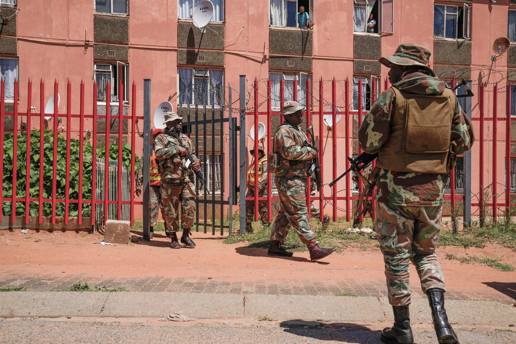 South African National Defense Forces deploy in the Riverlea township of Johannesburg, South Africa, Wednesday, March 11, 2026. (AP Photo/Themba Hadebe)