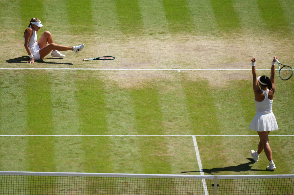 Guo Hanyu of China, right, and Kristina Mladenovic of France react after winning against Luisa Stefani of Brazil and Gabriela Dabrowski of Canada in the women's doubles final at Wimbledon Tennis Championships in London, Sunday, July 12, 2026. (AP Photo/Kirsty Wigglesworth)