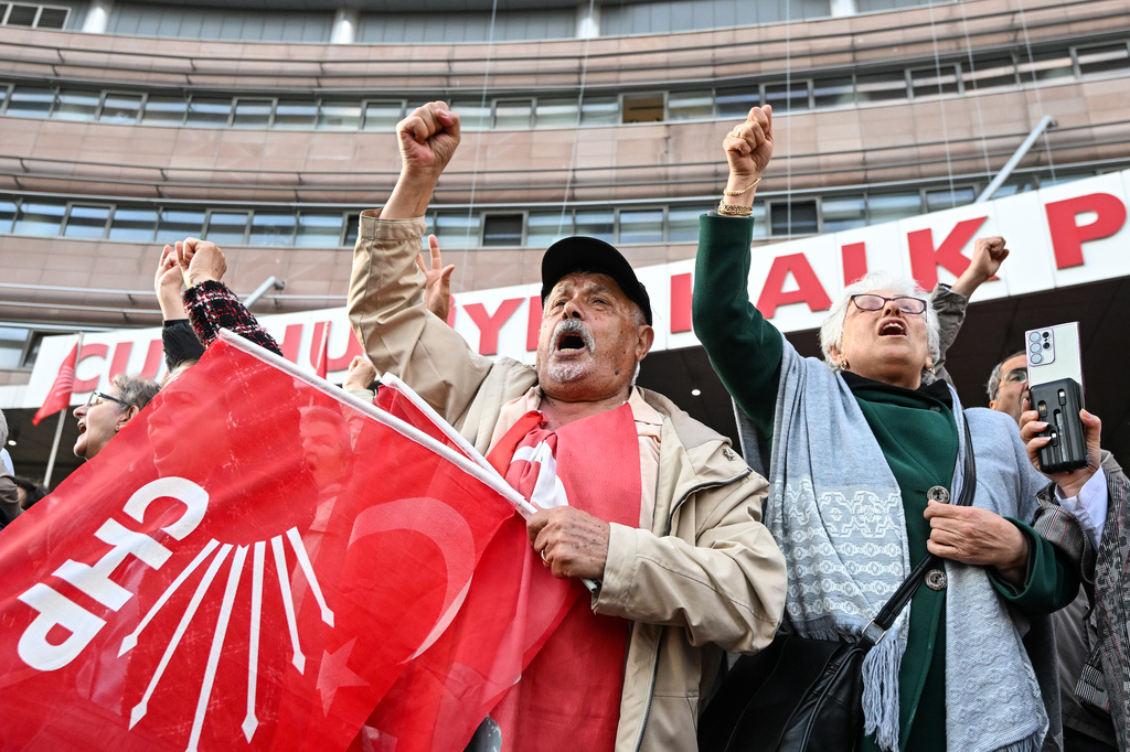 Supporters of Turkey's main opposition Republican People's Party, or CHP, shout slogans as they gather outside the party's headquarters in Ankara, Friday, May 22, 2026. (Gunsu Ozmen/DIA Photo via AP)