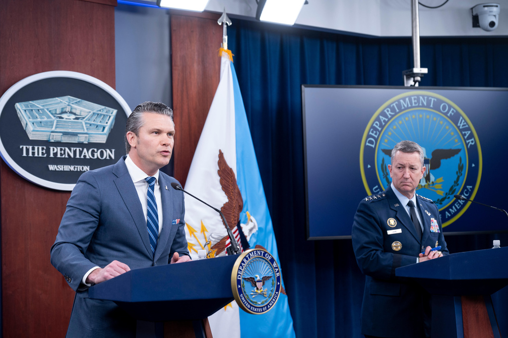 Defense Secretary Pete Hegseth and Chairman of the Joint Chiefs of Staff Gen. Dan Caine speaks to members of the media during a press briefing at the Pentagon, Thursday, April 16, 2026 in Washington. (AP Photo/Kevin Wolf)