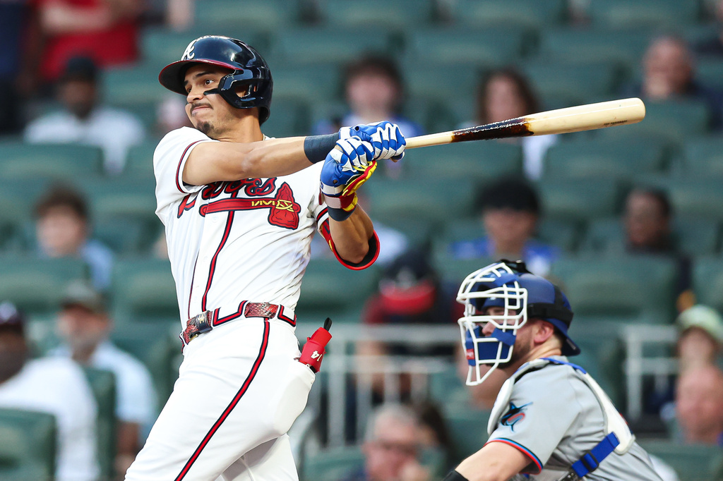 Atlanta Braves' Mauricio Dubón hits an RBI single in the second inning of a baseball game against the Miami Marlins, Wednesday, April 15, 2026, in Atlanta. (AP Photo/Colin Hubbard)