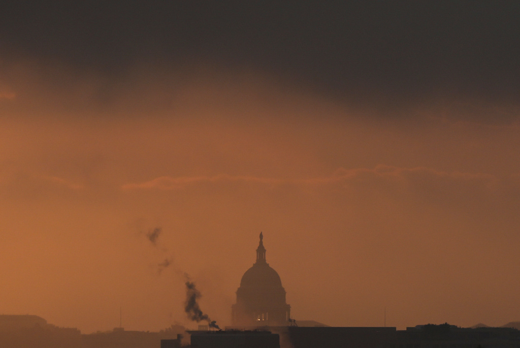 FILE - A sunrise view of the U.S. Capitol as seen from the National Cemetery in Arlington, Va., May 15, 2025. (AP Photo/Julia Demaree Nikhinson, File)