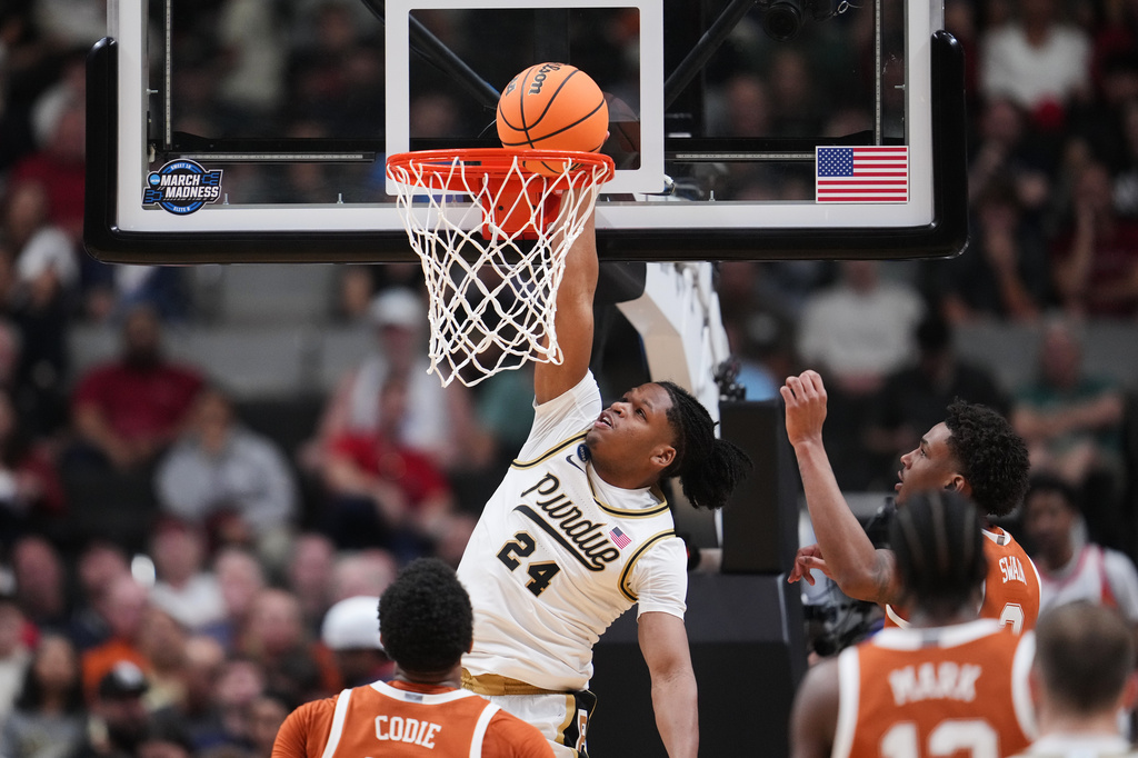 Purdue guard Gicarri Harris (24) dunks during the first half in the Sweet 16 of the NCAA college basketball tournament against Texas, Thursday, March 26, 2026, in San Jose, Calif. (AP Photo/Godofredo A. Vásquez)