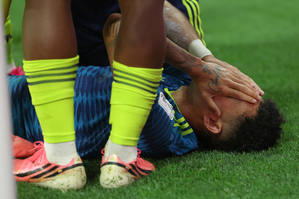 Colombia's Luis Diaz (7) covers his face as he celebrates with teammates after scoring their second goal during the World Cup Group K soccer match between Uzbekistan and Colombia in Mexico City, Wednesday, June 17, 2026. (AP Photo/Ashtin Barker)