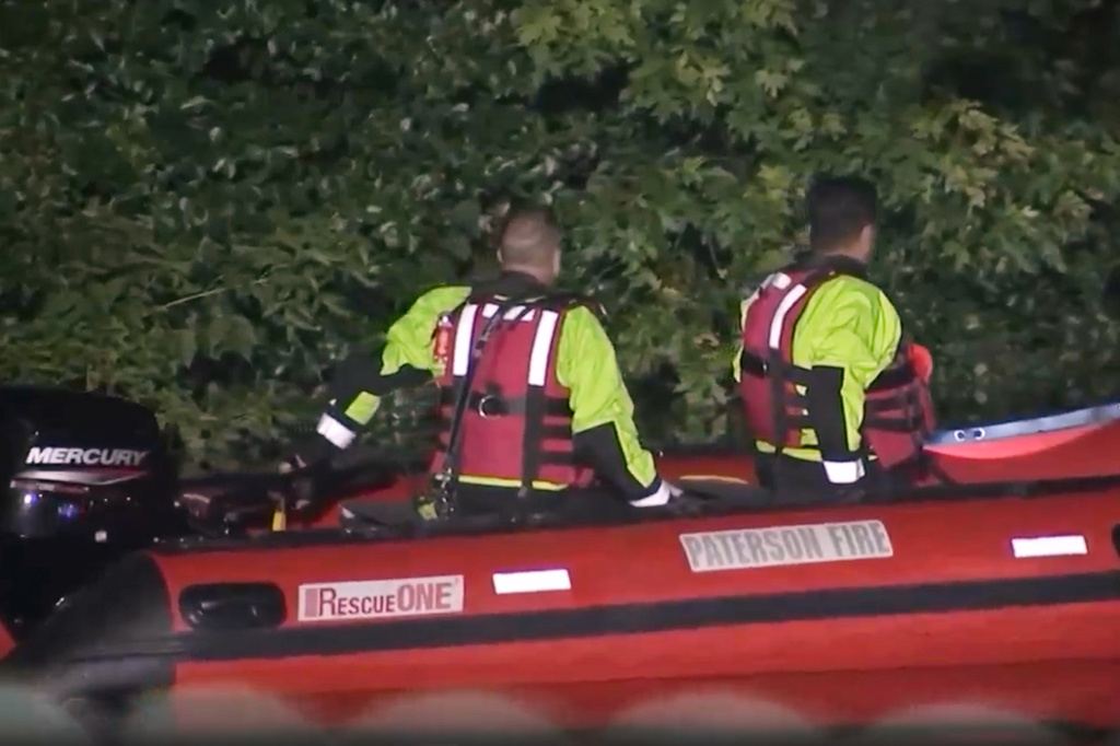 In this image taken from WABC-TV video, first responders search for missing children in the Passaic River, Wednesday, July 29, 2026, near Passaic, N.J. (WABC-TV via AP)