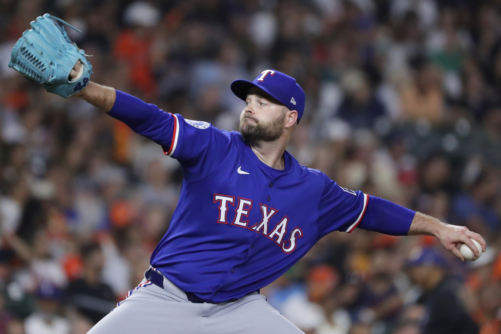 Texas Rangers relief pitcher Danny Coulombe throws against the Houston Astros during the fifth inning of a baseball game Tuesday, Sept. 16, 2025, in Houston. (AP Photo/Michael Wyke)