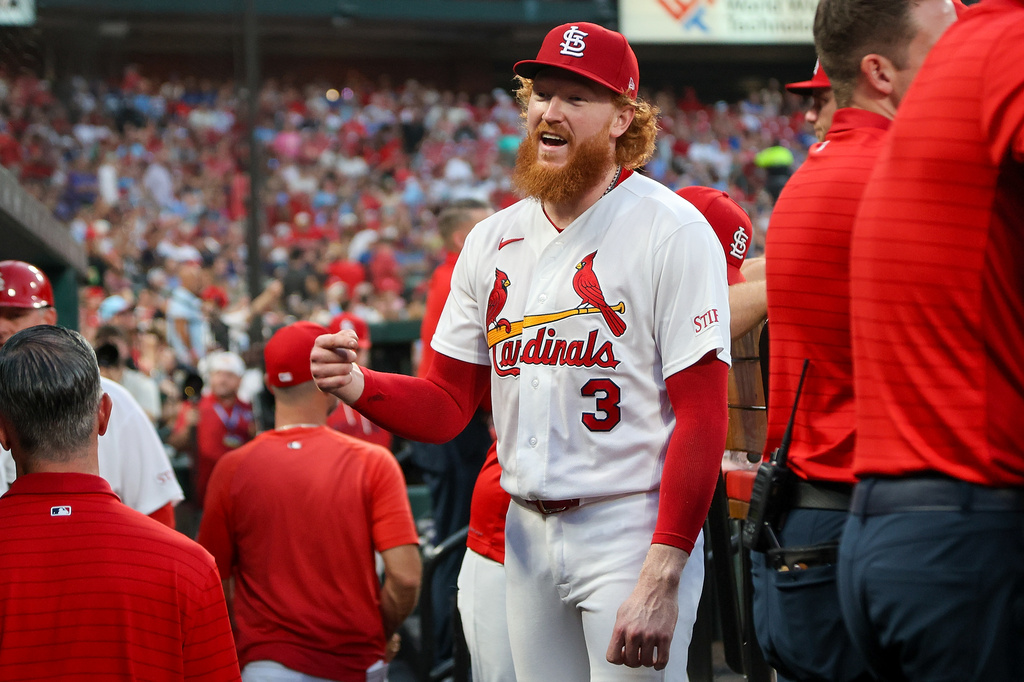 St. Louis Cardinals' Dustin May smiles as he talks with teammates in the dugout during the fifth inning of a baseball game against the Chicago Cubs Wednesday, July 29, 2026, in St. Louis. (AP Photo/Scott Kane)