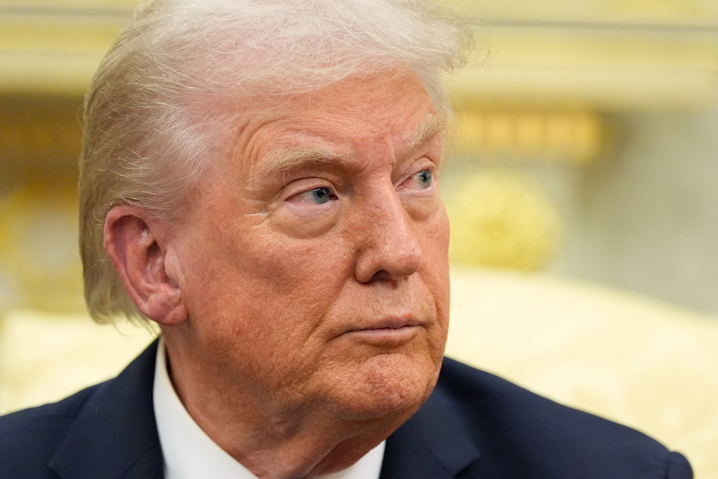 President Donald Trump listens to a question from a reporter as he meets with NATO Secretary General Mark Rutte in the Oval Office of the White House, Wednesday, Oct. 22, 2025, in Washington. (AP Photo/Alex Brandon)