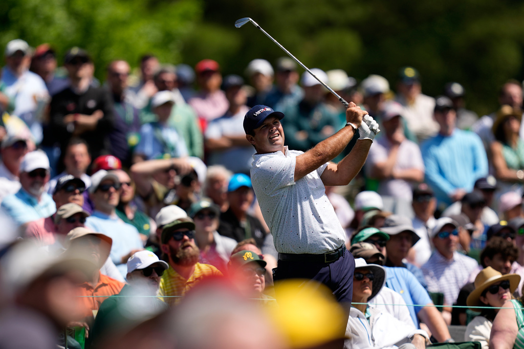 Patrick Reed watches his tee shot on the 12th hole during a practice round ahead of the Masters golf tournament at the Augusta National Golf Club, Tuesday, April 7, 2026, in Augusta, Ga. (AP Photo/David J. Phillip)