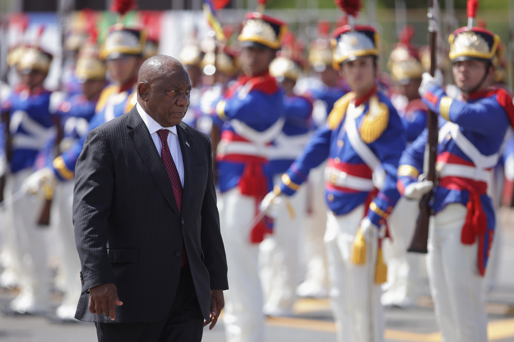 FILE - South Africa's President Cyril Ramaphosa receives military honors during a welcome ceremony at the Planalto Presidential Palace, prior to a meeting with Brazilian President Luiz Inacio Lula da Silva in Brasilia, Brazil, March 9, 2026. (AP Photo/Luis Nova, File)