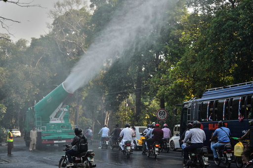 Workers of Environment Protection Agency spray water with anti-smog guns at a road in Lahore, Pakistan, Thursday, Oct. 23, 2025. (AP Photo/K.M. Chaudary) Workers of Environment Protection Agency spray water with anti-smog guns at a road in Lahore, Pakistan, Thursday, Oct. 23, 2025. (AP Photo/K.M. Chaudary)