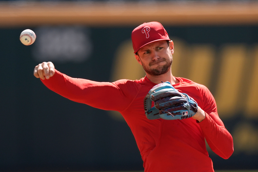 Philadelphia Phillies shortstop Trea Turner throws a ball before Game 1 of baseball's National League Wild Card Series against the Atlanta Braves Tuesday, Sept. 29, 2026, in Atlanta. (AP Photo/Mike Stewart)