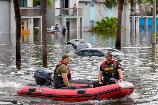 FILE - A water rescue boat moves in floodwaters at an apartment complex in the aftermath of Hurricane Milton, Oct. 10, 2024, in Clearwater, Fla. (AP Photo/Mike Stewart, File) FILE - A water rescue boat moves in floodwaters at an apartment complex in the aftermath of Hurricane Milton, Oct. 10, 2024, in Clearwater, Fla. (AP Photo/Mike Stewart, File)