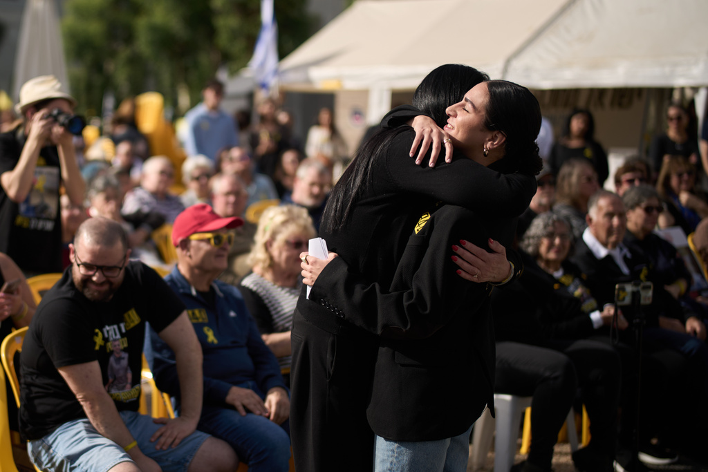 Shira Gvili, right, embraces her mother Talik during a rally calling for the return of her brother Ran Gvili, who was killed while fighting Hamas militants during the Oct. 7, 2023 attack and whose body has been held in Gaza ever since, in Tel Aviv, Israel, Friday, Jan. 23, 2026. (AP Photo/Leo Correa)