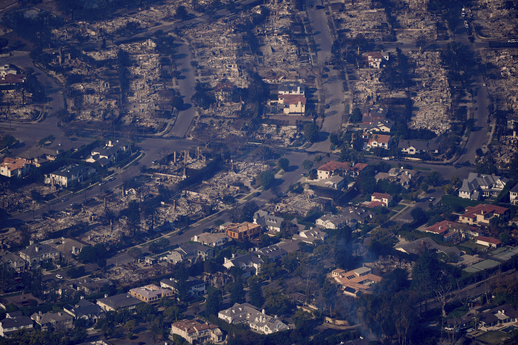 The devastation from the Palisades Fire is seen from the air in the Pacific Palisades neighborhood of Los Angeles, Thursday, Jan. 9, 2025. (AP Photo/Mark J. Terrill)