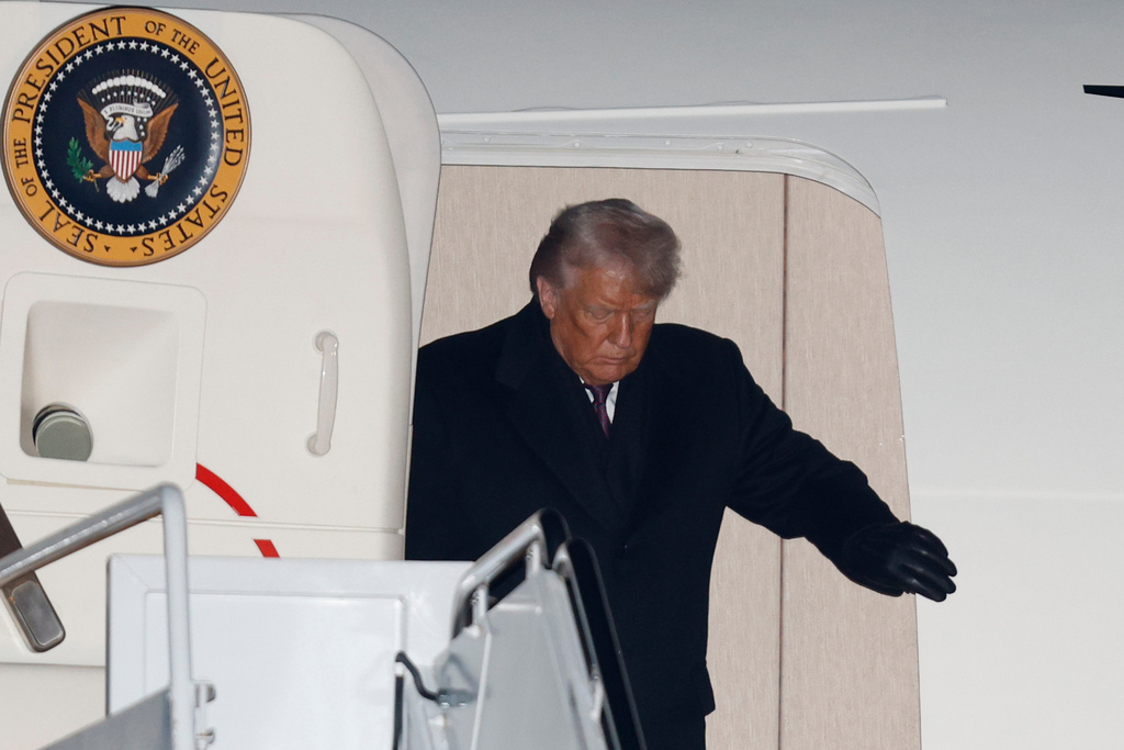 President Donald Trump arrives on Air Force Oneat Joint Base Andrews, Md., Thursday, Jan. 22, 2026, after returning from the World Economic Forum in Davos. (AP Photo/Luis M. Alvarez)