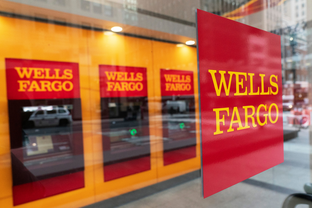 FILE - A Wells Fargo office in New York, displays its logos at its ATM, Jan. 13, 2021. (AP Photo/Mark Lennihan, File)