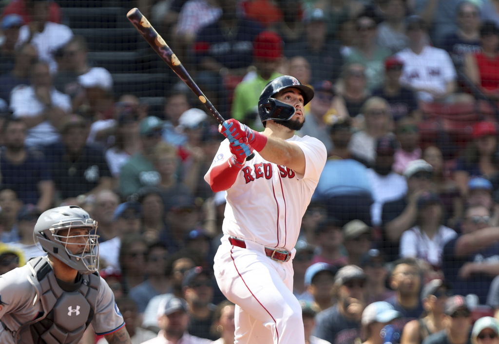 The Boston Red Sox's Wilyer Abreu, right, watches the flight of his fourth-inning two-run home run during a baseball game against the Miami Marlins, Sunday, Aug. 17, 2025, in Boston. (AP Photo/Jim Davis)