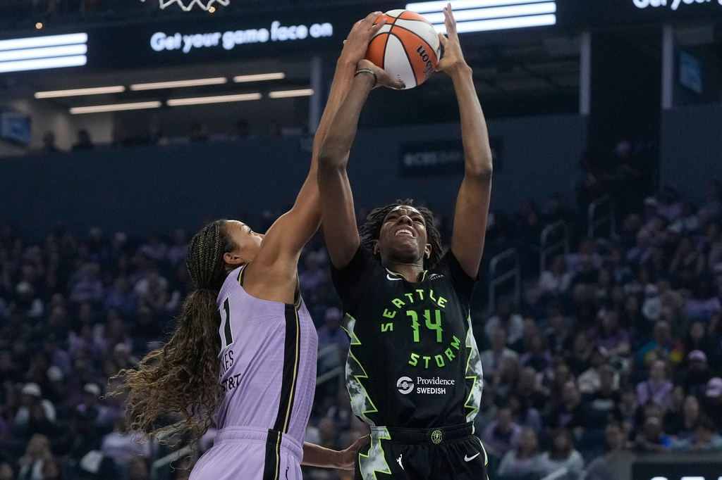 Golden State Valkyries center Kiah Stokes, left, blocks a shot attempt by Seattle Storm center Dominique Malonga (14) during the first half of a WNBA basketball game in San Francisco, Saturday, Sept. 19, 2026. (AP Photo/Jeff Chiu)