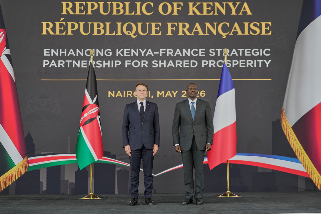 France's President Emmanuel Macron, left, and Kenya's President William Ruto stand during the national anthem at State House in Nairobi, Sunday, May 10, 2026. (AP Photo/Brian Inganga)