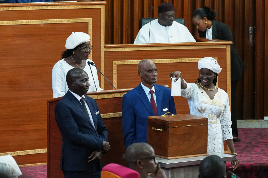 A member of parliament casts her ballot to elect Ousmane Sonko as the President of the National Assembly in Dakar, Senegal, Tuesday, May 26, 2026,(AP Photo/Misper Apawu) CORRECTION: Name corrected to Ousmane instead of Ousman