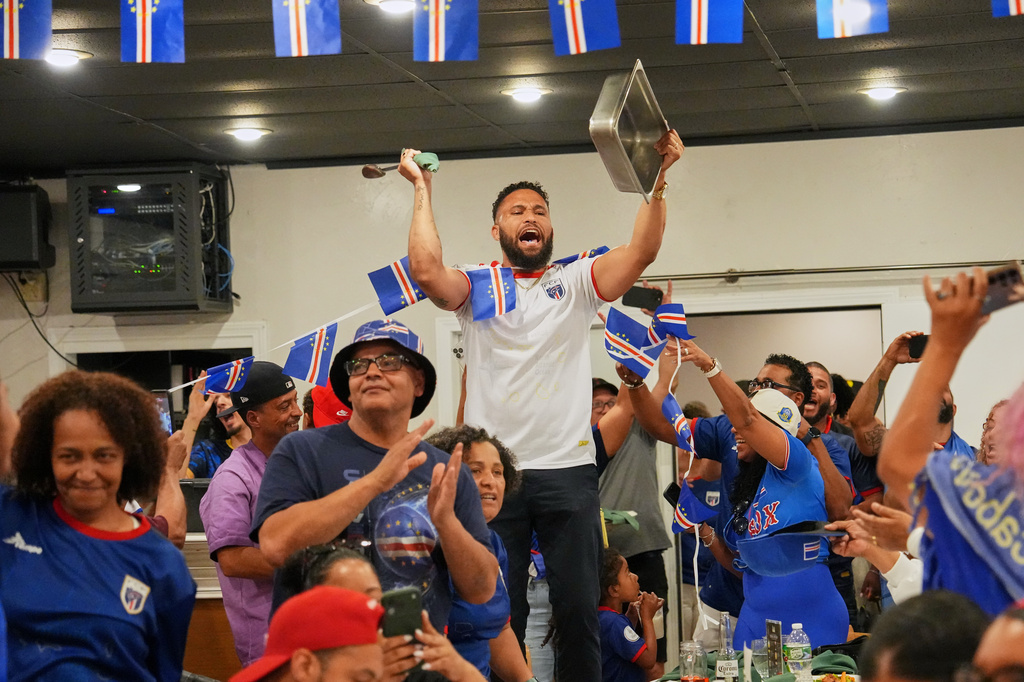 Cape Verde supporters celebrate after they watched the World Cup Group H soccer match between Uruguay and Cape Verde at a restaurant at a Cape Verde community in Brockton, Mass. near Boston, Sunday, June 21, 2026. (AP Photo/Martin Meissner)